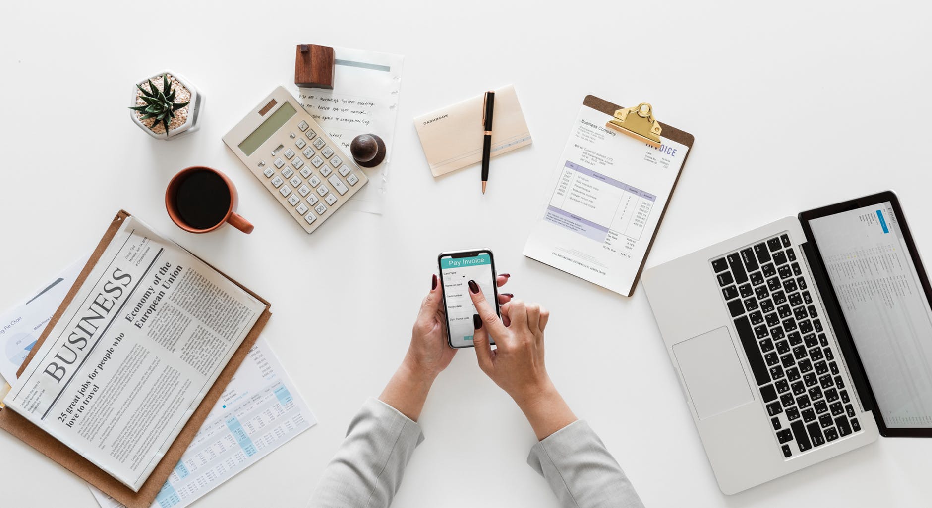 Executive assistant paying invoices at their office