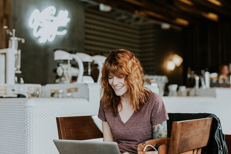 Virtual assistant at her laptop, thriving in her role
