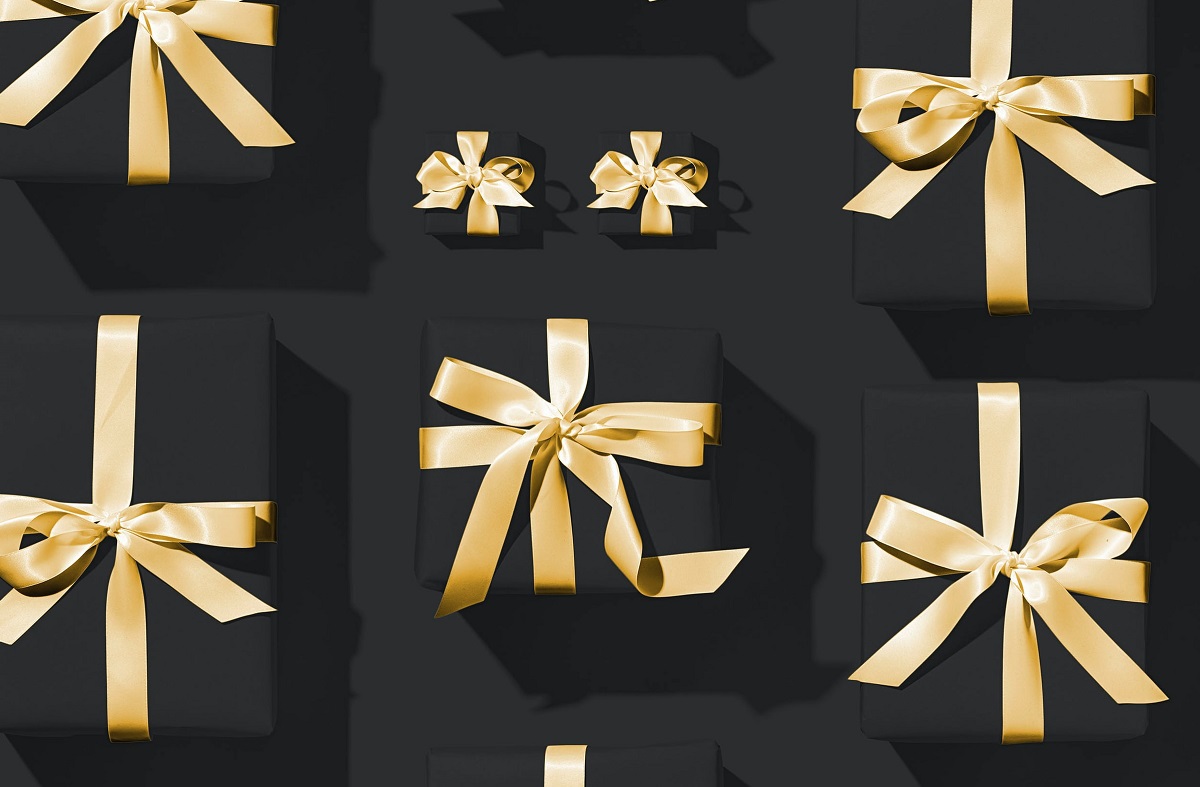 Corporate gifts wrapped with gold ribbons