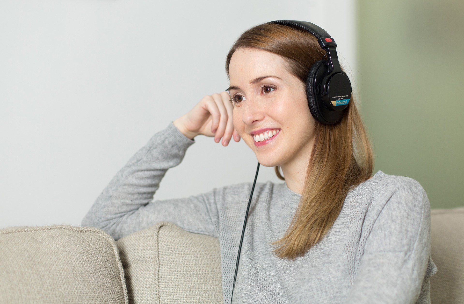 Woman working from home with headphones on