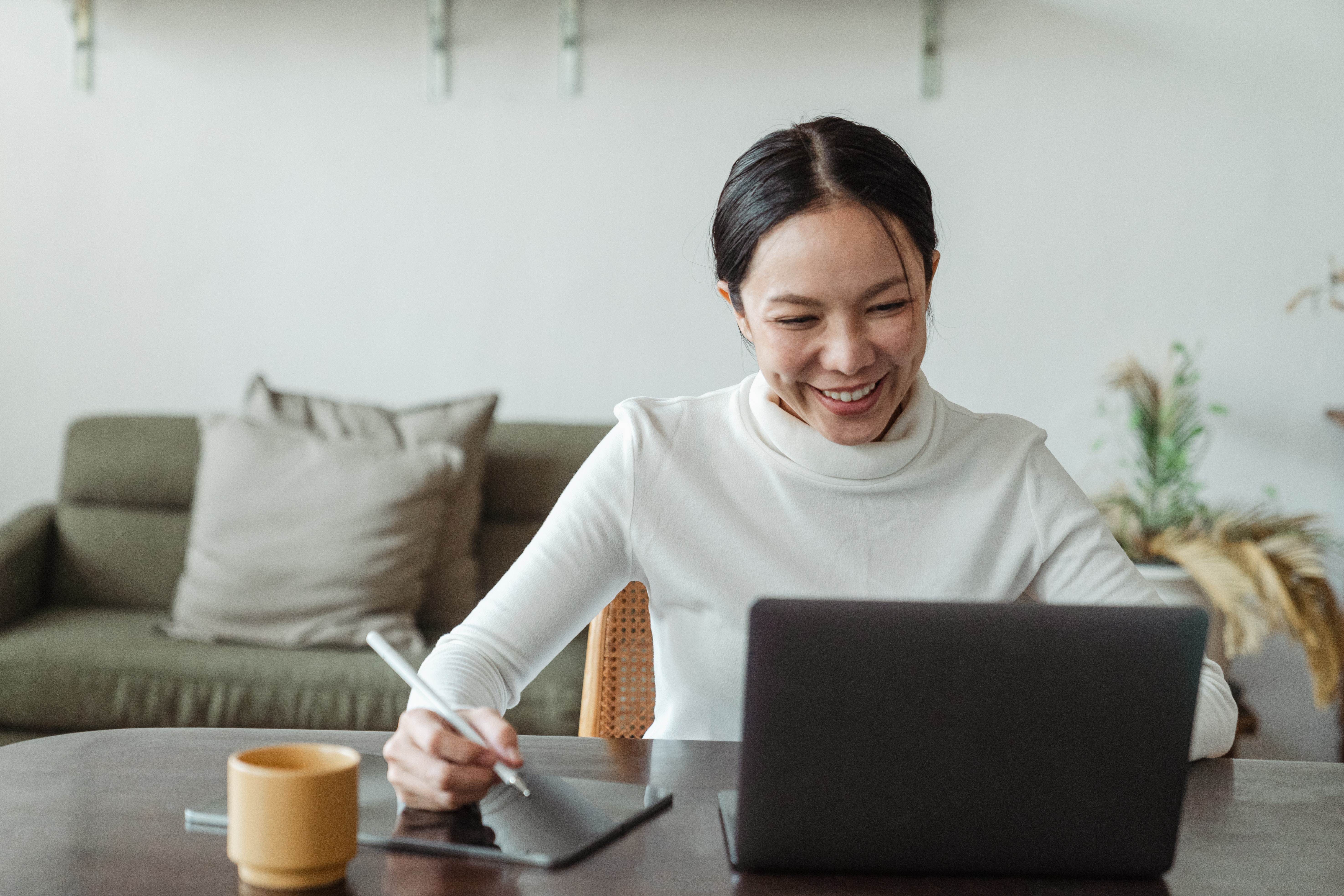 Woman smiling while taking some notes