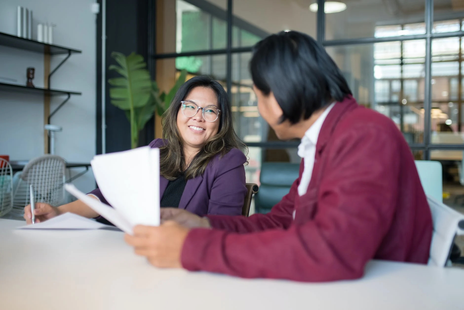 HR assistants having a laugh while doing flexible office work