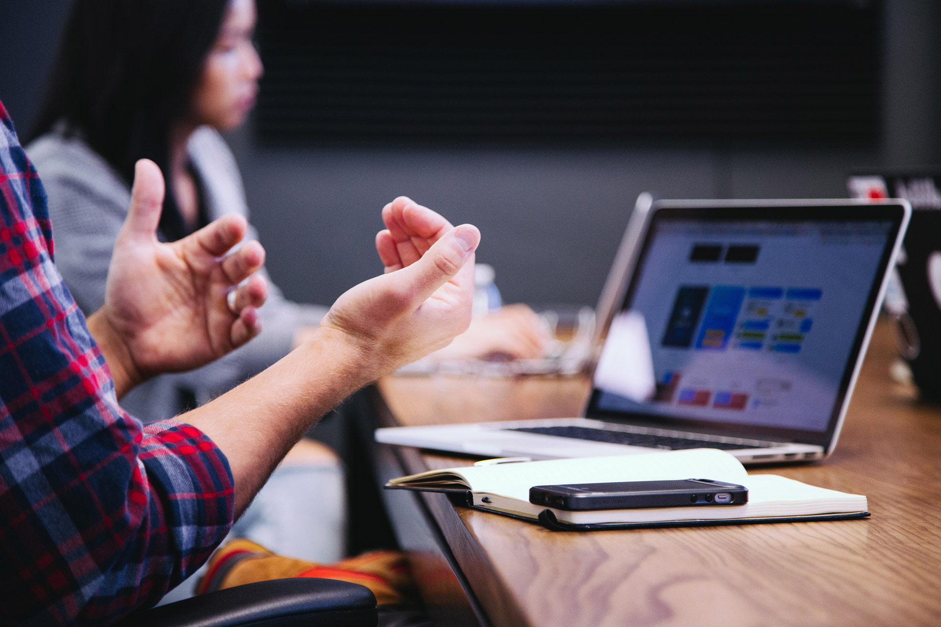 Personal assistant making hand gestures while in an office space