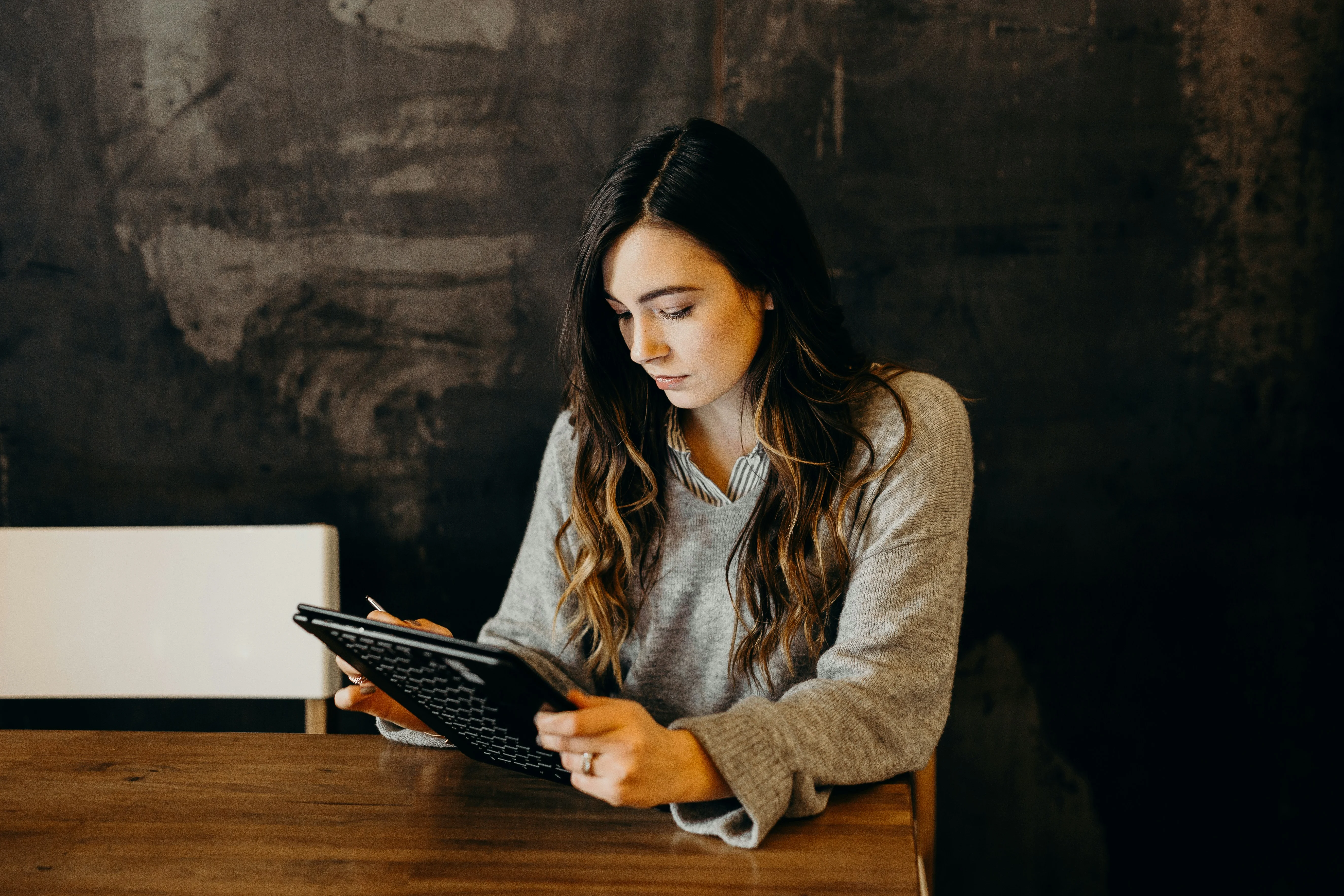 A personal assistant looks at her monthly salary on her banking app.