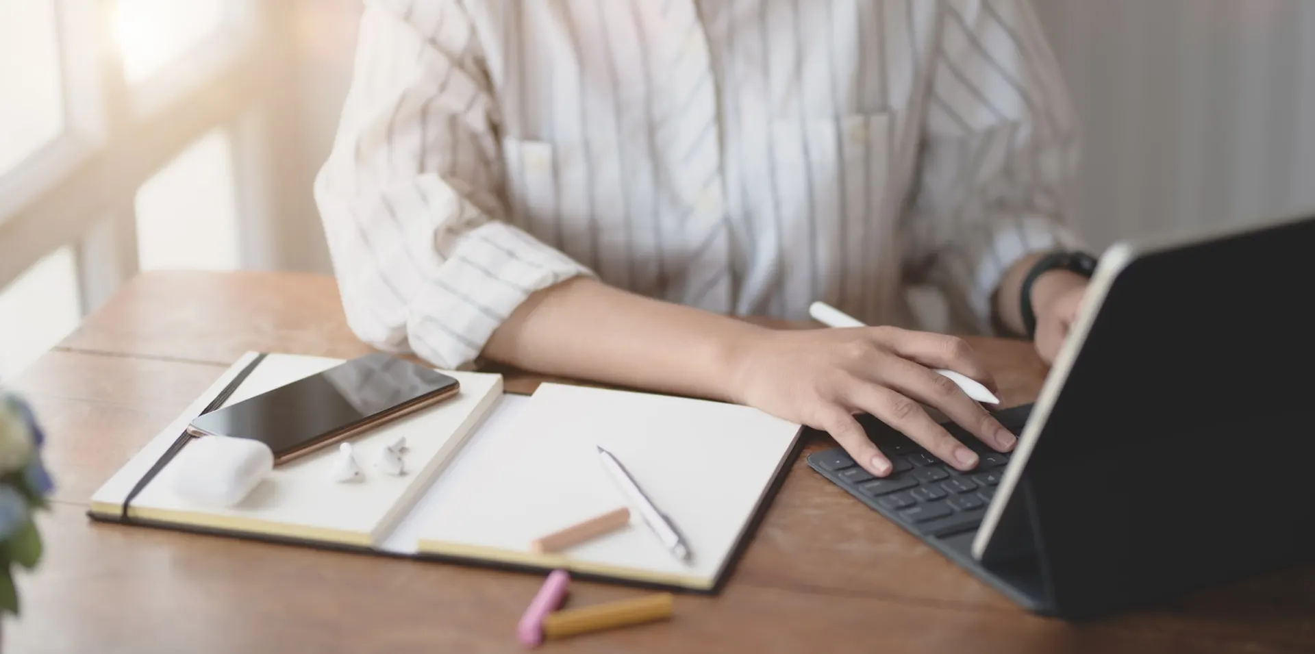 A personal assistant candidate writing a cover letter on her laptop