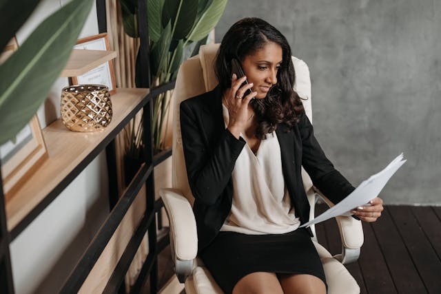 An admin recruiter on the phone to potential admin candidates