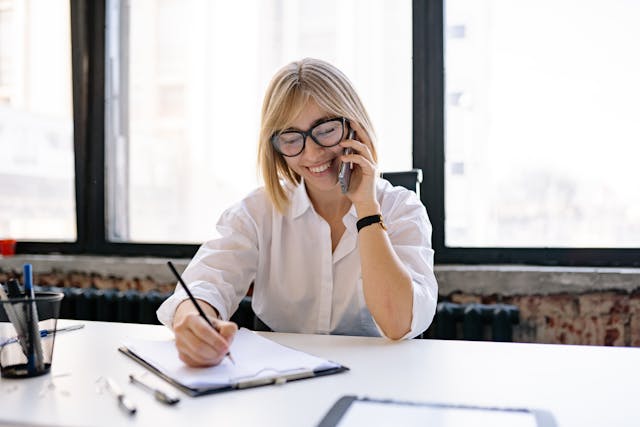 An admin assistant sat at a desk working