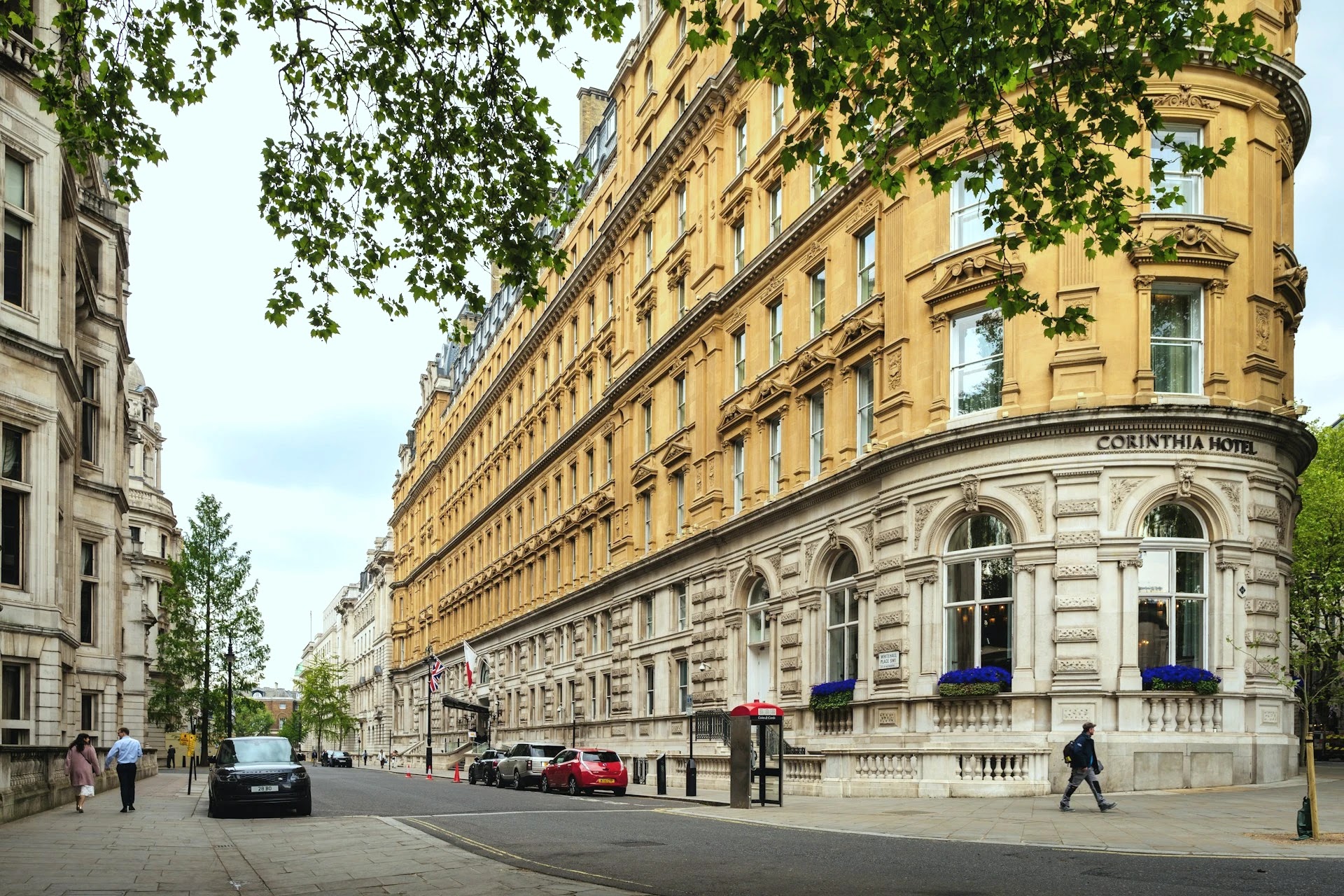 Grand Victorian buildings and the Corinthia Hotel on a central London street
