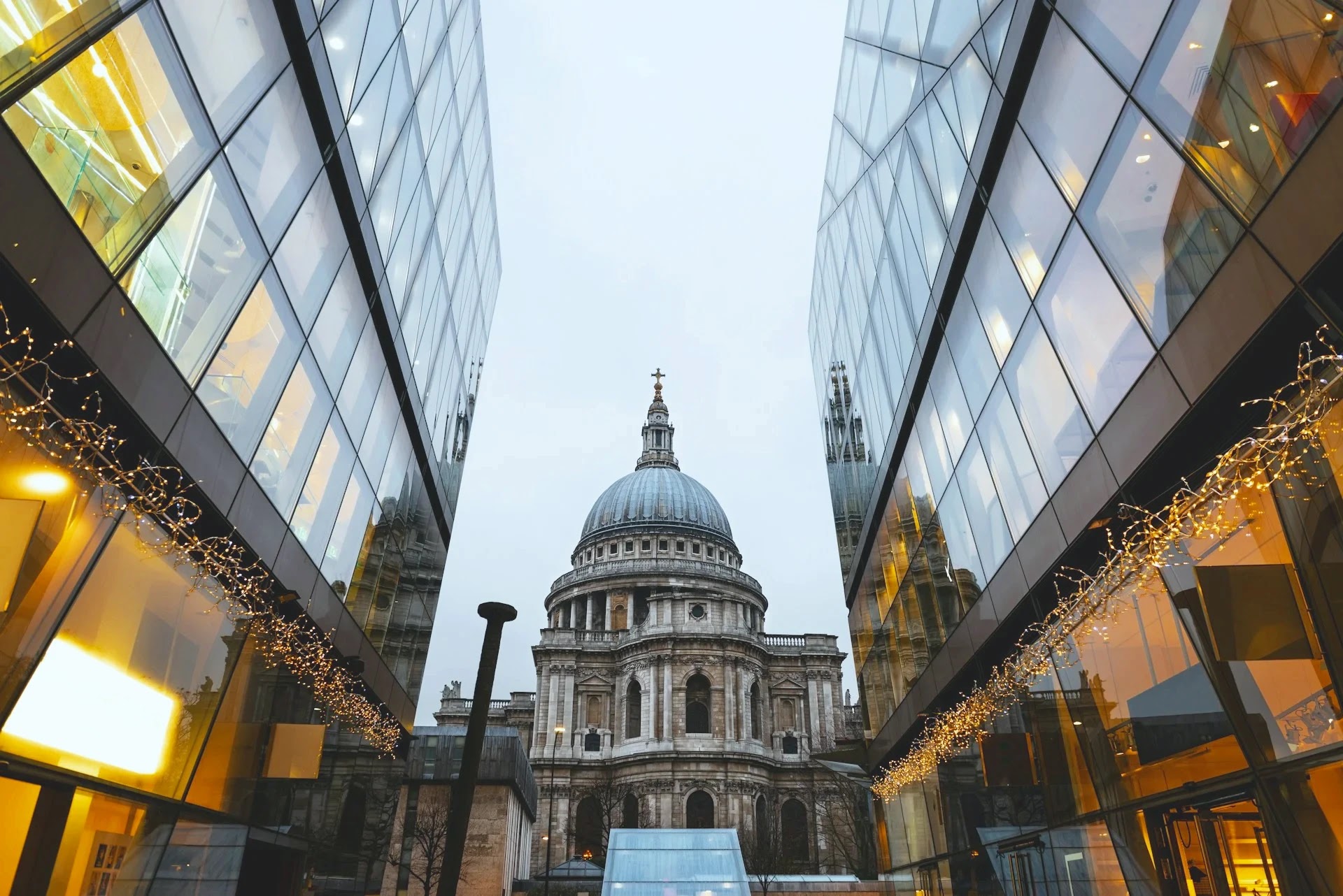 St Paul's Cathedral dome framed between modern glass buildings in the City of London
