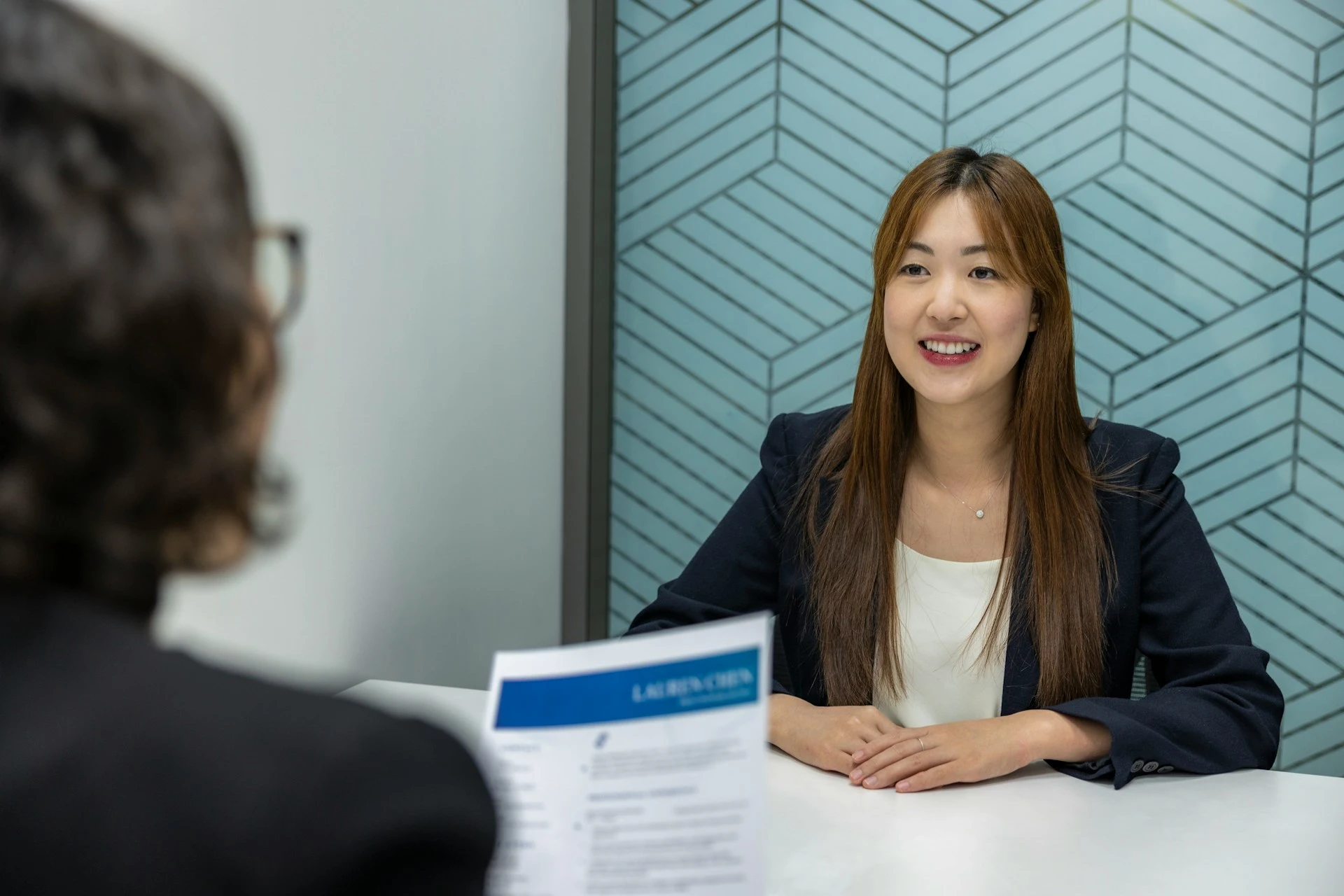A recruiter interviews a woman for a chief of staff role